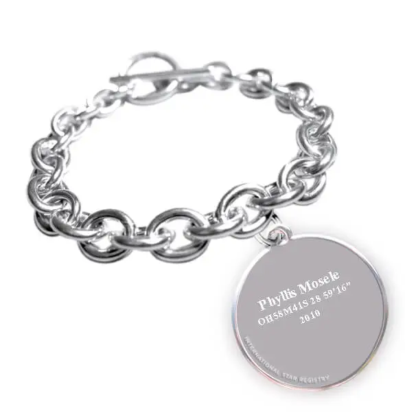 Solid sterling silver charm bracelet and round pendant engraved with the name of the star and its location in the sky.